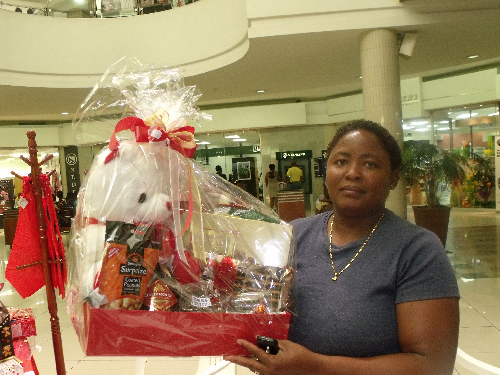 Meme Hilma Uushona is one of the many people who could not find office space. She’s seen here selling valentine’s hampers in an open space in the Wernhil mall. “Business is very good,” she told the Economist. (Photograph by Nyasha Francis Nyaungwa)