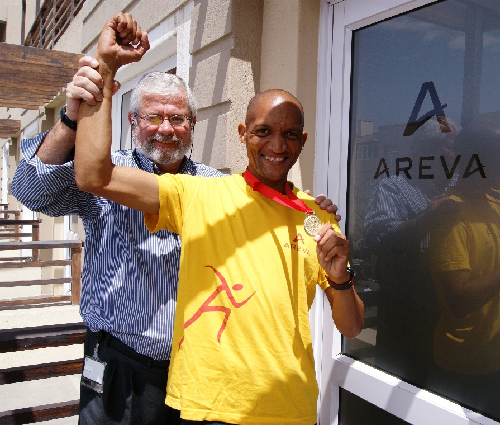 Alain L’Hour, managing director: AREVA Namibia congratulates Erich Goeieman on a new record set at the Benguella West Coast Marathon last Saturday. (Photograph contributed)