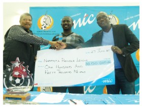From the left is the league administrator of the Namibia Premier League, Josua Povey Hoebeb, NPL head:sponsorship and marketing, Mabos Vries and John Ekongo, Corporate Communications Officer at MTC. (Photographed by Yvonne Amukwaya.)