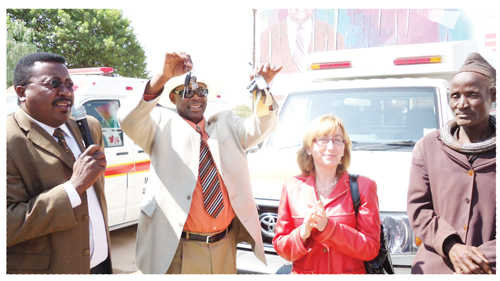  The Minister of Health and Social Services, Dr. Richard Kamwi receiving the three ambulances donated to the Opuwo State hospital from the Spanish Ambassador to Namibia, Carmen Díez.