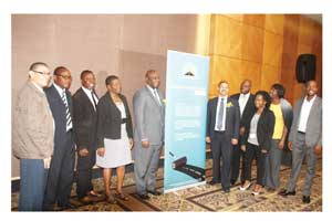 Acting CEO of the Roads Authority Conrad Lutombi and Acting Divisional Manager for Transport Information and Regulatory Services Melvin Van Wyk with Roads Authority staff members at the launch. (Photograph contributed).