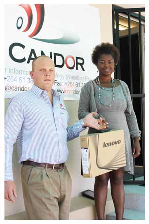 Volker Engling, MD of Candor IT, donated a laptop to the Tourist Guides Association of Namibia to strengthen their administrative capacity. The organisation’s secretary, Meke Imbili, received the computer.