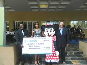 (From Left to Right) Prof Errol Tyobeka, Advisor to the Rector’s Office, Ms Sybil Julius, Manager: Retail Advice Centre, Old Mutual, Minnie Mouse and Ms Frieda Shimbuli, Dean of Students at the Polytechnic with the N$80,000 cheque sponsored by Old Mutual. (Photograph By Mandisa Rasmeni)