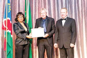 Ms. Maria Luisa Abrantes (left) Secretary of State of the Angolan Government, with Hans Nolte, Vice President and General Manager of Dundee Precious Metals Tsumeb, and new chairperson of the NCCI, Sven Thieme, when Dundee Precious received the Most Supportive Corporate award from the chamber. Ms Abrantes was the guest speaker at the chamber AGM.