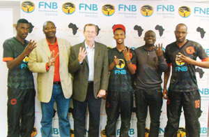 Quattro in a row: Ian Leyenaar, Chief Executive Officer of FNB Namibia poses with some of the Black Africa members during the bank’s recent contribution to the team’s outstanding performance of winning the league four times in a row.