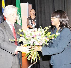 The Minister of Finance, Hon. Saara Kuugongelwa-Amadhila, officiated over the DBN Good Business Awards and Innovation Award for 2014. Pictured above, DBN Board Member Albie Basson presents her with a bouquet of flowers to show the bank’s gratitude.