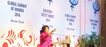 Chairperson of the Global Summit of Woman, Irene Natividad, giving her introductory remarks before the official opening ceremony. 