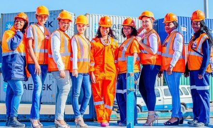 Namport women show hard hats and high heels both fashion items