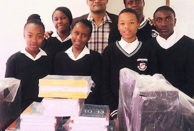 Karundu Secondary School advances with new computers, text books and cash contribution