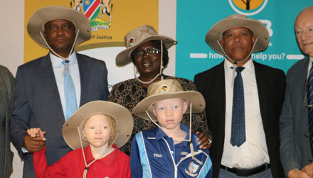 Local bank supports albinism sufferers, donates 250 sun protection hats