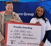 Donated funds from local bank to help feed 80 children at Hope Village